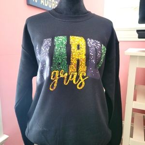 A Mardi Gras black with multiple color "DTF" printed sweatshirt